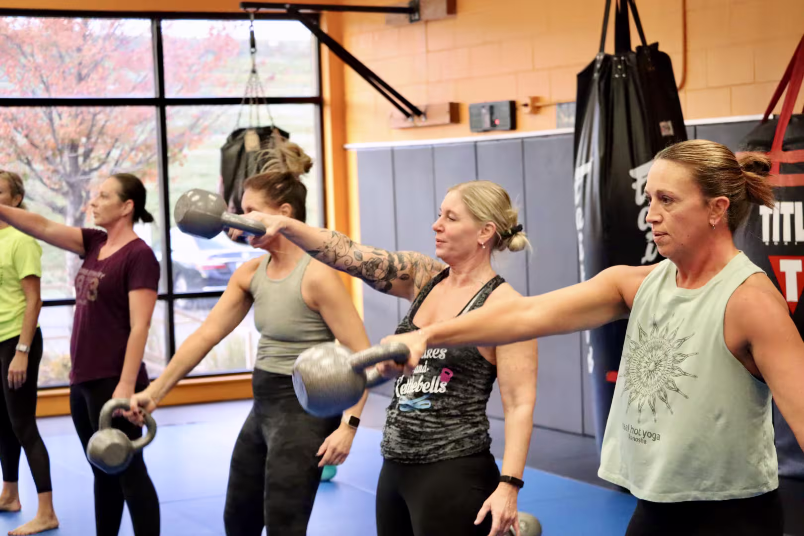 women doing kettlebell swings
